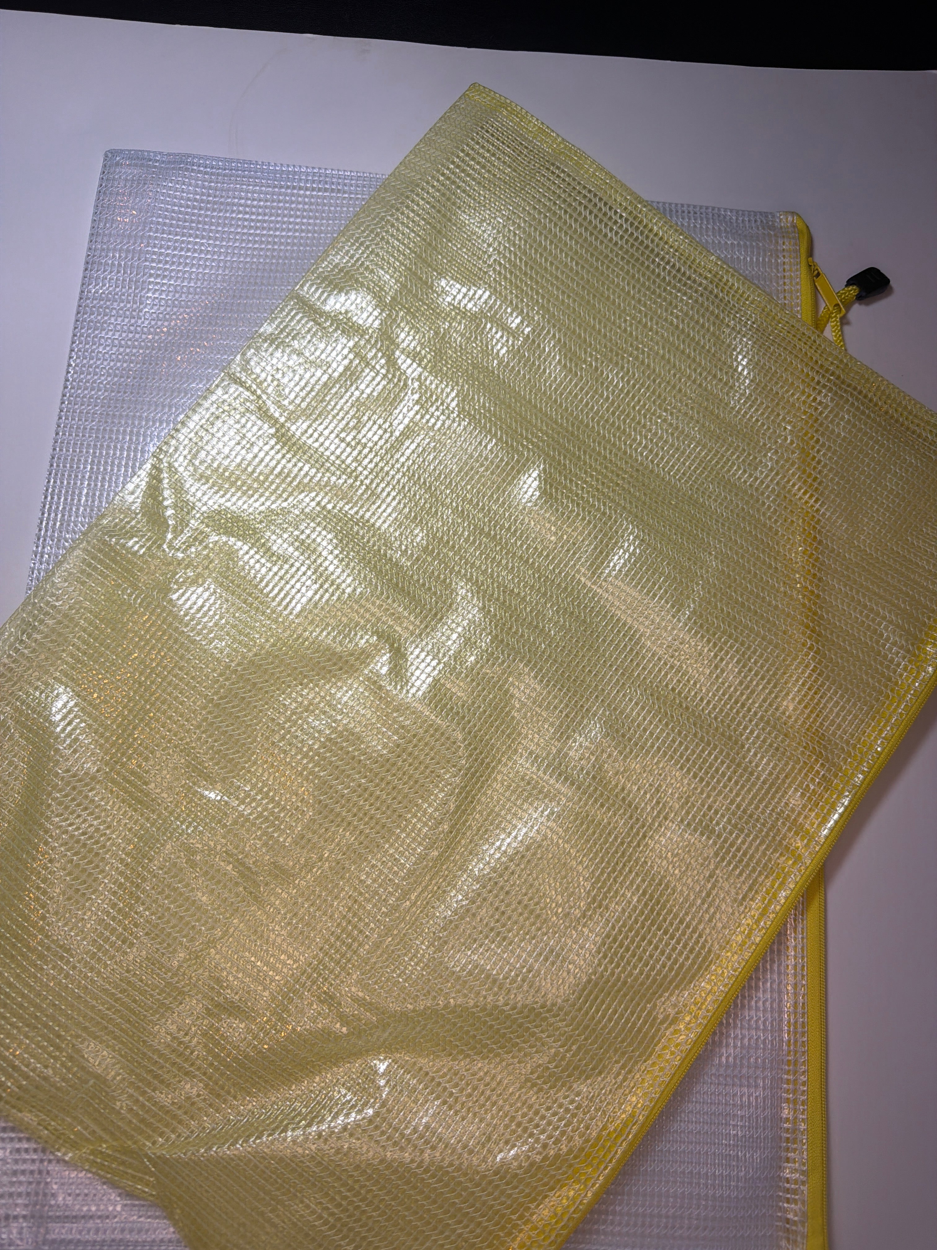 Project Bag: large plastic bag with yellow zipper