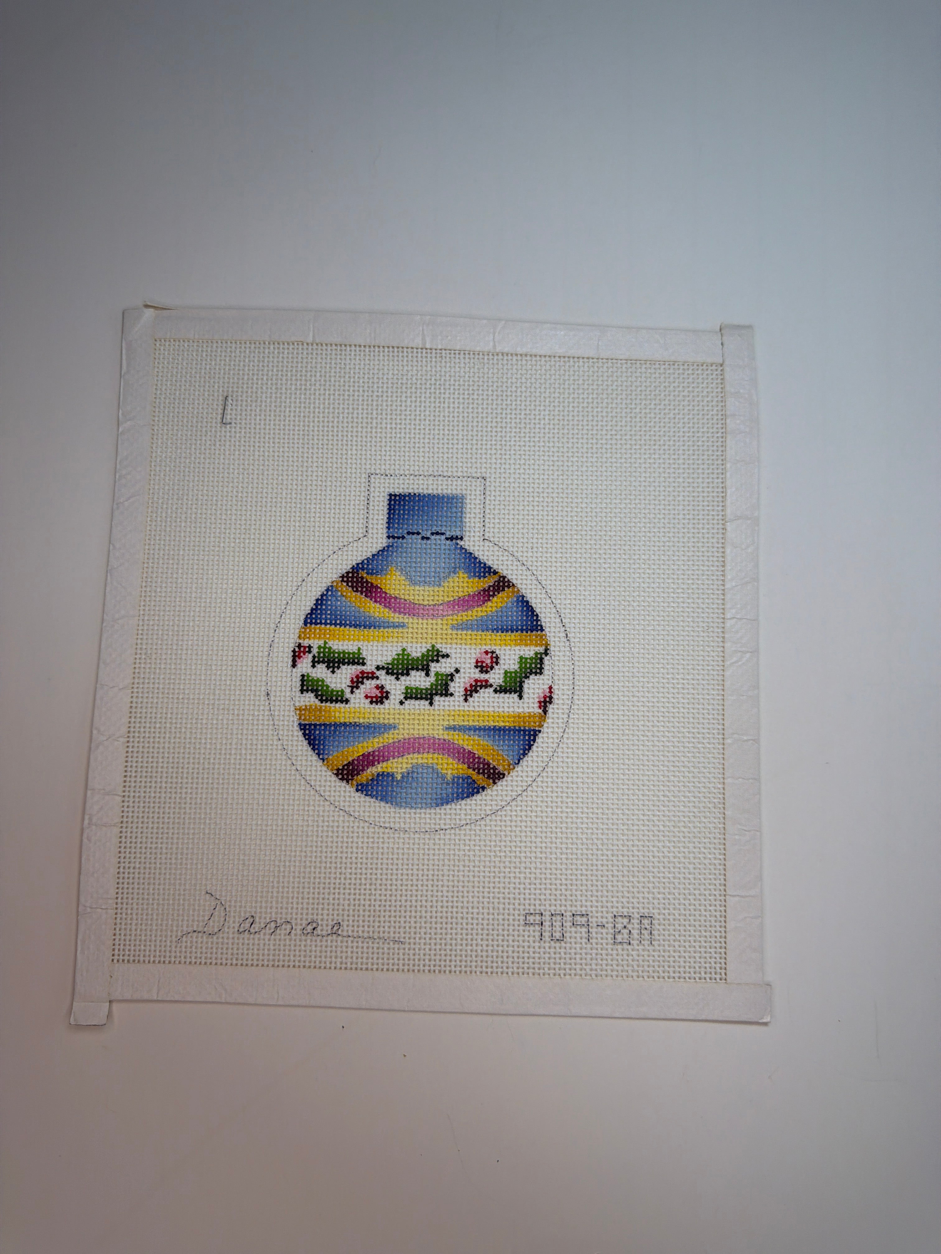 Blue and Yellow Ornament with Holly