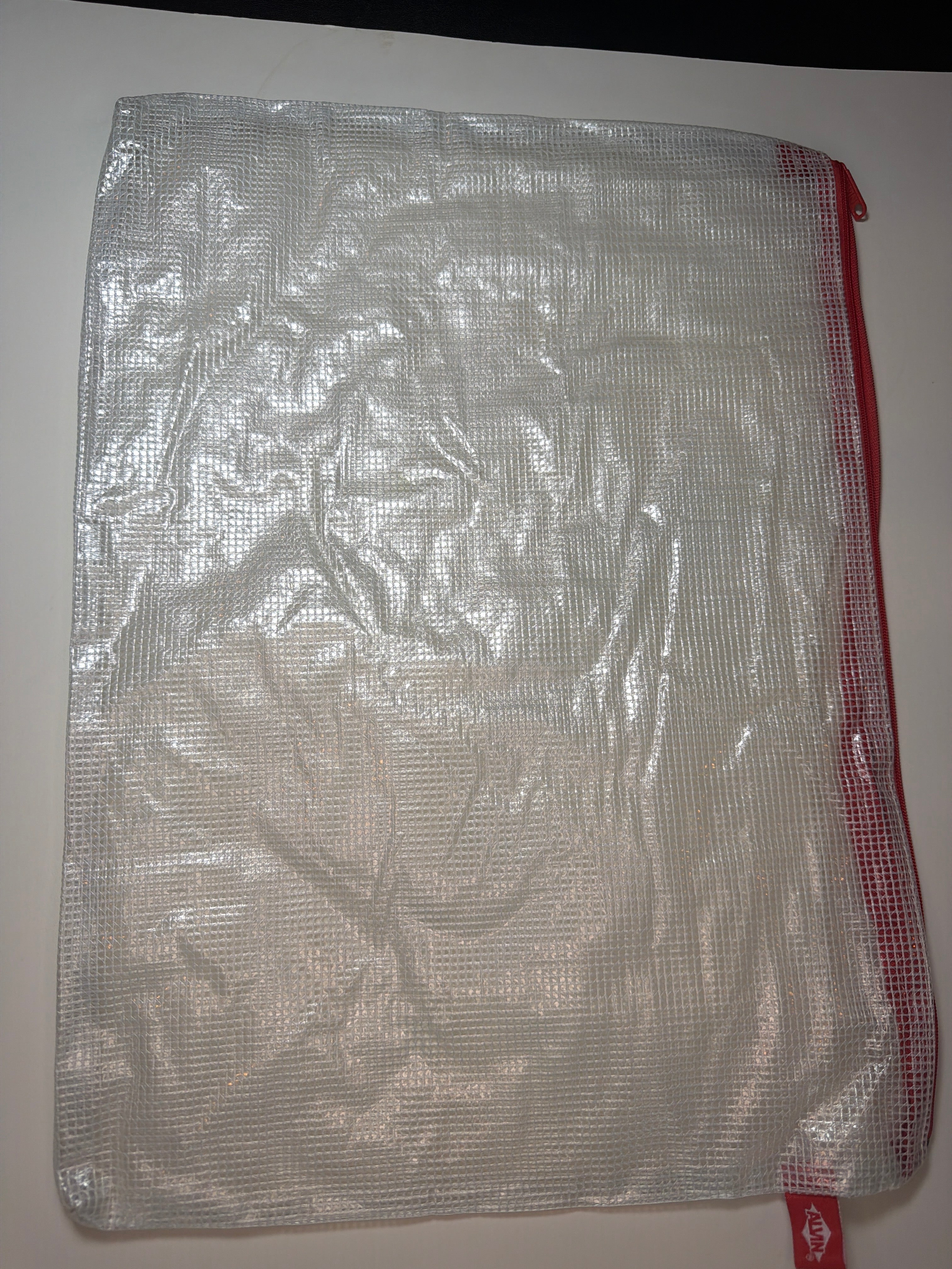 Project Bag: large plastic bag with red zipper